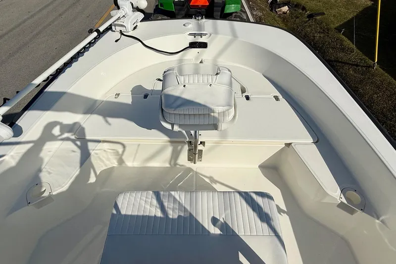 Slide: The Image of 2017 Boston Whaler 210 Montauk boat interior with seating and fishing equipment. - 12