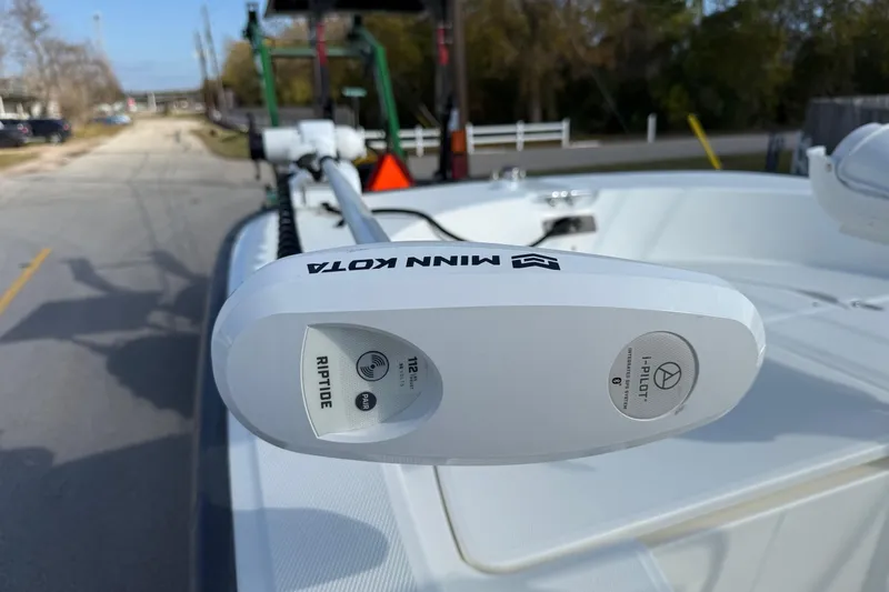 Slide: The Image of Minn Kota Riptide motor on 2017 Boston Whaler 210 Montauk boat, parked on a street. - 17