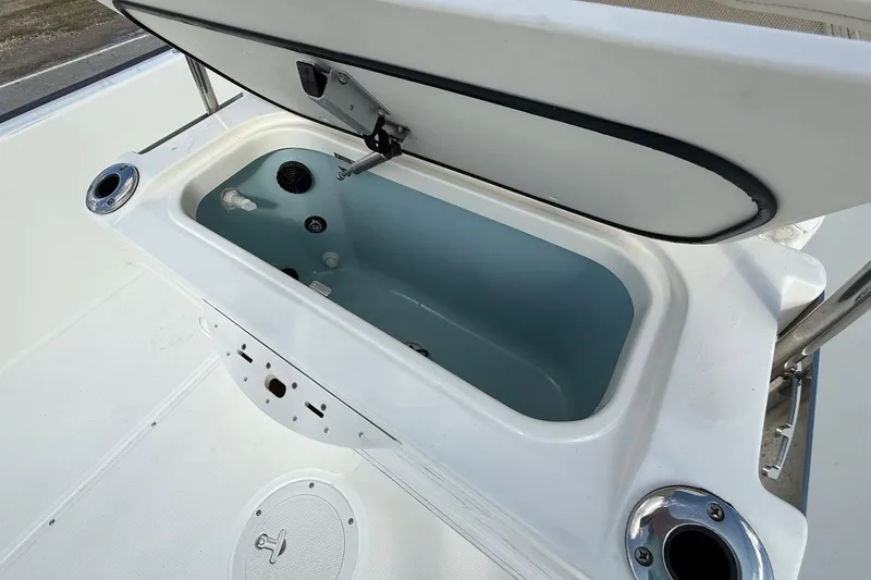 Slide: The Image of Open storage compartment on a 2017 Boston Whaler 210 Montauk boat. - 19