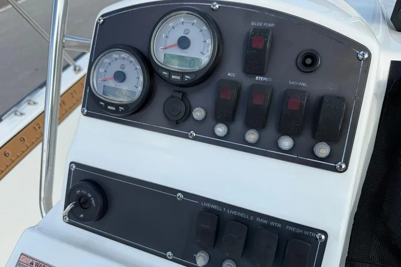 Slide: The Image of Control panel of a 2017 Boston Whaler 210 Montauk boat with gauges and switches. - 21