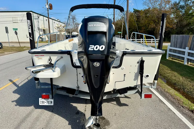 Slide: The Image of 2017 Boston Whaler 210 Montauk boat with 200 Verado engine on a street. - 3