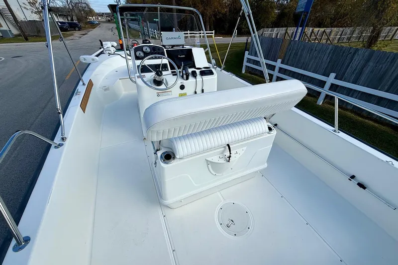Slide: The Image of 2017 Boston Whaler 210 Montauk boat interior with steering console and seating. - 8