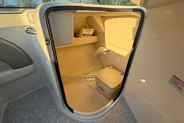 Slide: The Image of Interior storage compartment of a 2005 Sea Ray 220 Sundeck boat. - 12