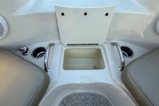 Slide: The Image of Interior of 2005 Sea Ray 220 Sundeck with cup holders. - 19