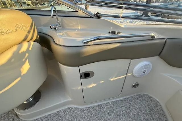 Slide: The Image of 2005 Sea Ray 220 Sundeck interior with sink, storage, and speaker. - 25