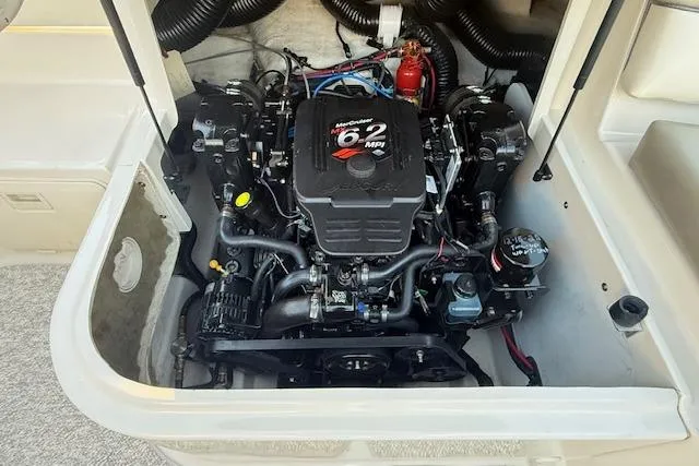 Slide: The Image of Engine compartment of a 2005 Sea Ray 220 Sundeck boat, featuring a 6.2 MPI engine. - 28