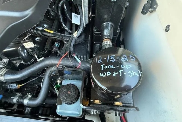 Slide: The Image of Engine compartment of 2005 Sea Ray 220 Sundeck with maintenance notes on component. - 30