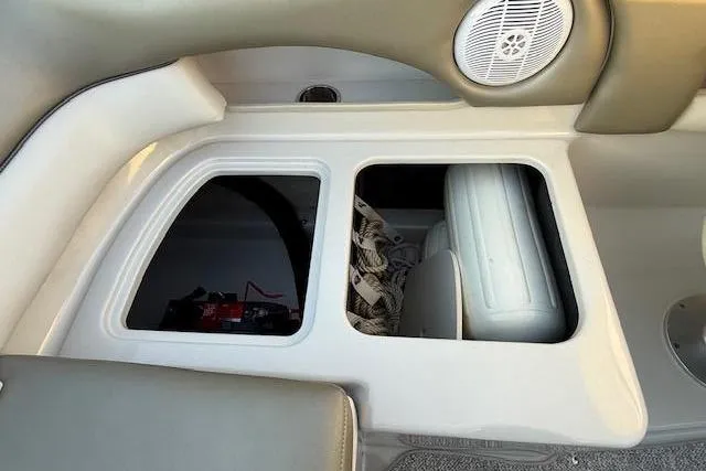 Slide: The Image of Interior of a 2005 Sea Ray 220 Sundeck boat with storage compartment. - 31