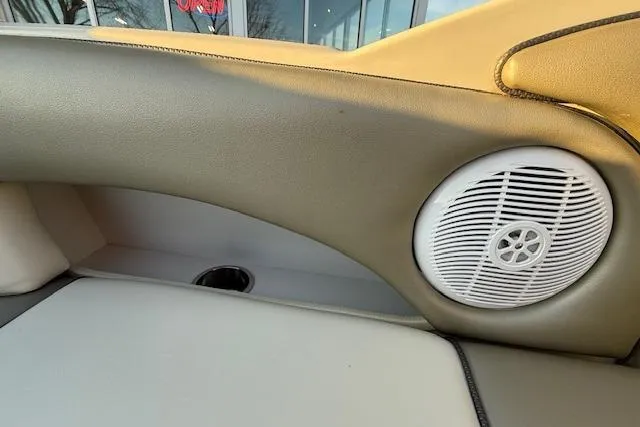 Slide: The Image of Interior of 2005 Sea Ray 220 Sundeck with speaker and cup holder. - 32