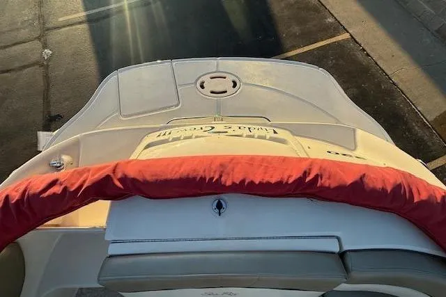 Slide: The Image of Rear view of a 2005 Sea Ray 220 Sundeck boat at sunset. - 33