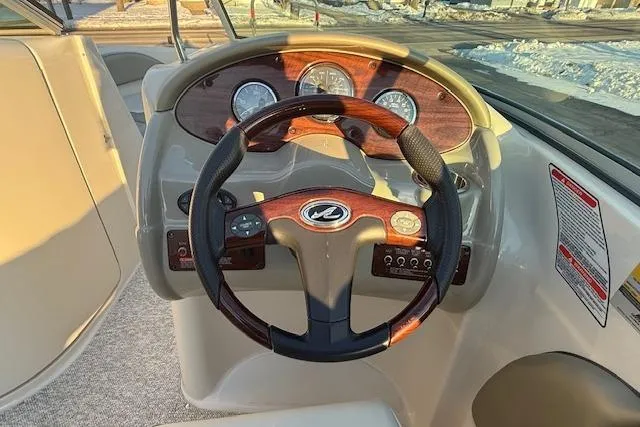 Slide: The Image of Steering wheel and dashboard of 2005 Sea Ray 220 Sundeck boat. - 6
