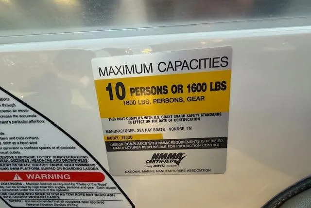 Slide: The Image of 2005 Sea Ray 220 Sundeck capacity label: 10 persons or 1600 lbs, 1800 lbs with gear. - 7