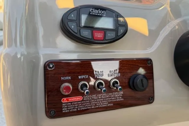 Slide: The Image of Control panel of a 2005 Sea Ray 220 Sundeck with Clarion audio system. - 8