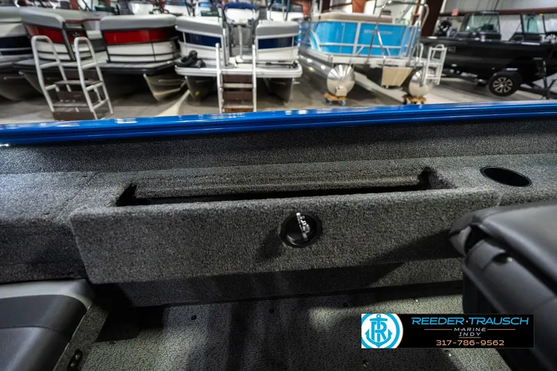 Slide: The Image of Interior view of 2026 Lund 1675 Adventure SS boat, showcasing storage and seating. - 22