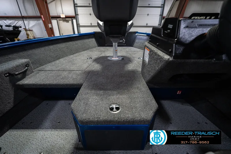 Slide: The Image of 2026 Lund 1675 Adventure SS boat interior with carpeted deck and seating. - 24