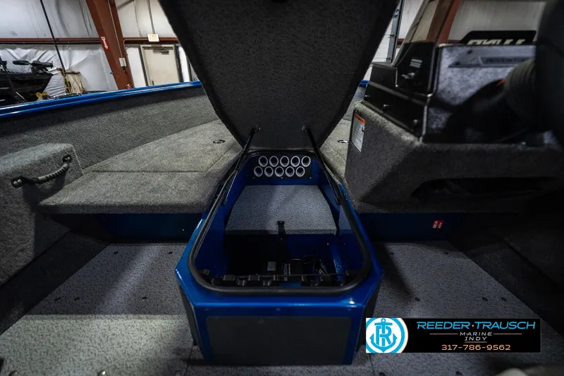 Slide: The Image of 2026 Lund 1675 Adventure SS boat interior with storage compartment open. - 25