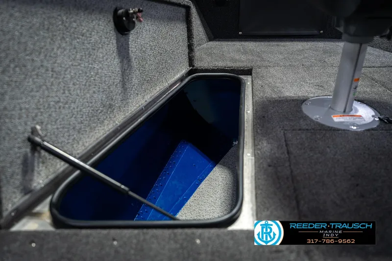 Slide: The Image of 2026 Lund 1675 Adventure SS boat interior storage compartment with carpeted finish. - 27
