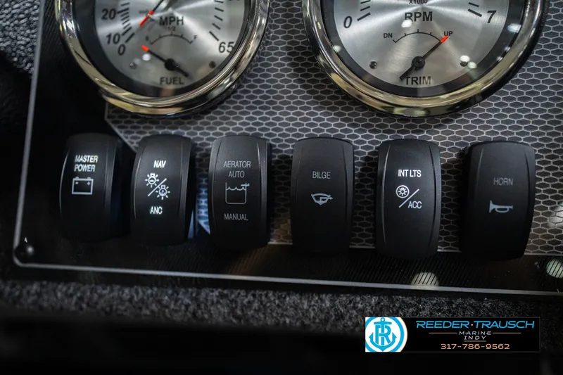 Slide: The Image of Dashboard controls of 2026 Lund 1675 Adventure SS boat with gauges and switches. - 33