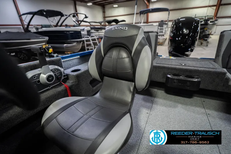 Slide: The Image of 2026 Lund 1675 Adventure SS boat interior with steering console and seating. - 35