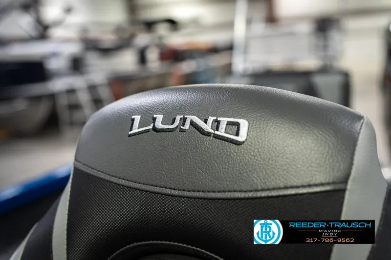 Slide: The Image of Close-up of Lund 1675 Adventure SS boat seat, showcasing logo and stitching. - 36