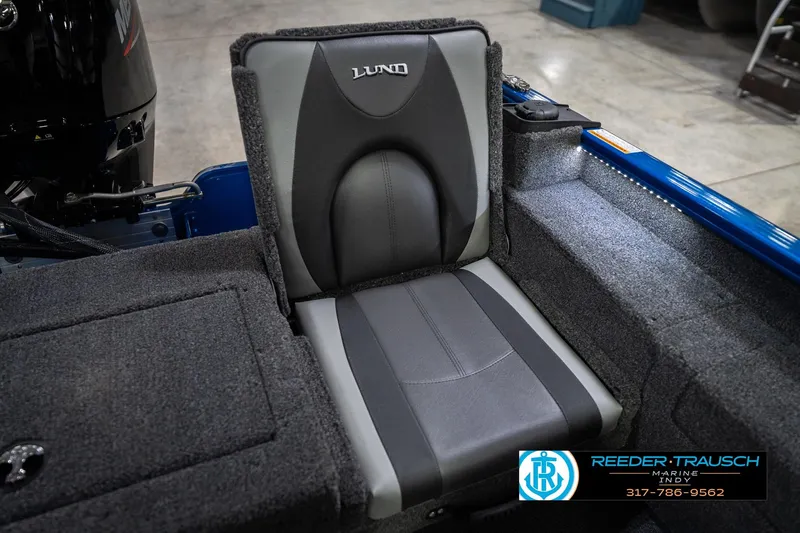 Slide: The Image of 2026 Lund 1675 Adventure SS boat seat with gray upholstery and logo. - 37