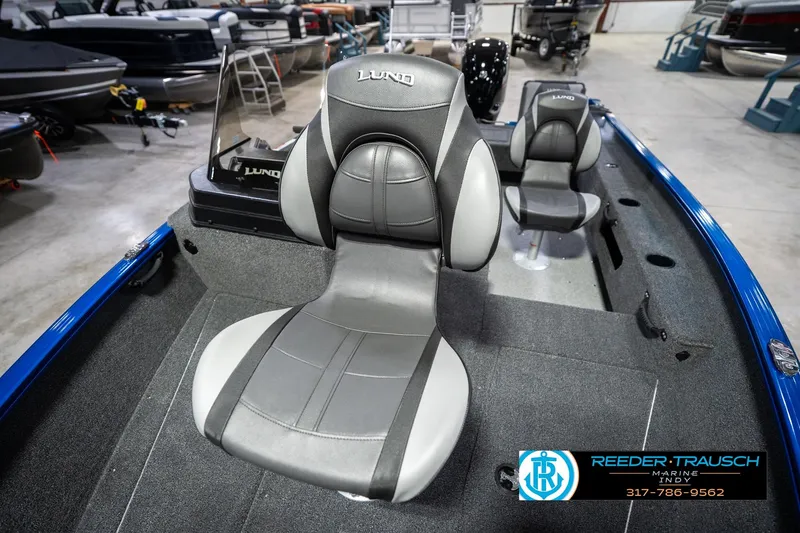 Slide: The Image of 2026 Lund 1675 Adventure SS boat interior with comfortable seating in showroom. - 39