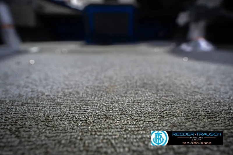 Slide: The Image of Carpeted floor of a 2026 Lund 1675 Adventure SS boat interior. - 41