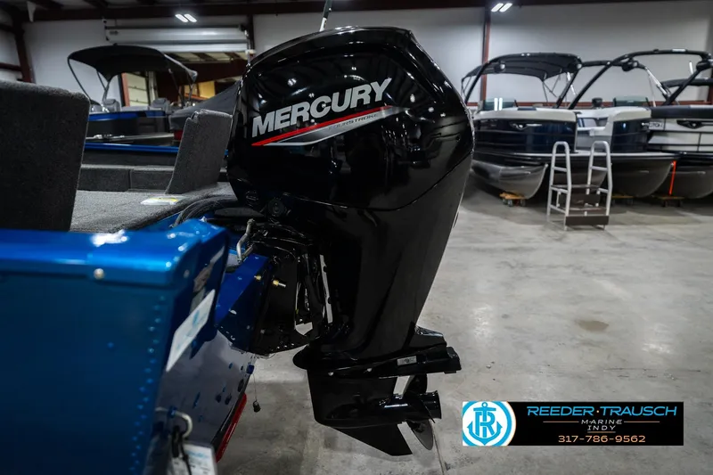 Slide: The Image of 2026 Lund 1675 Adventure SS with Mercury outboard motor in showroom. - 42