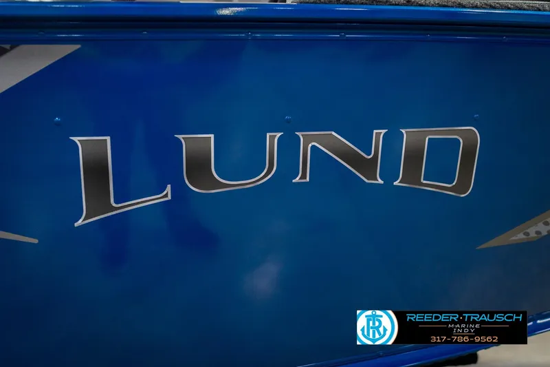 Slide: The Image of 2026 Lund 1675 Adventure SS boat with blue exterior and logo. - 46