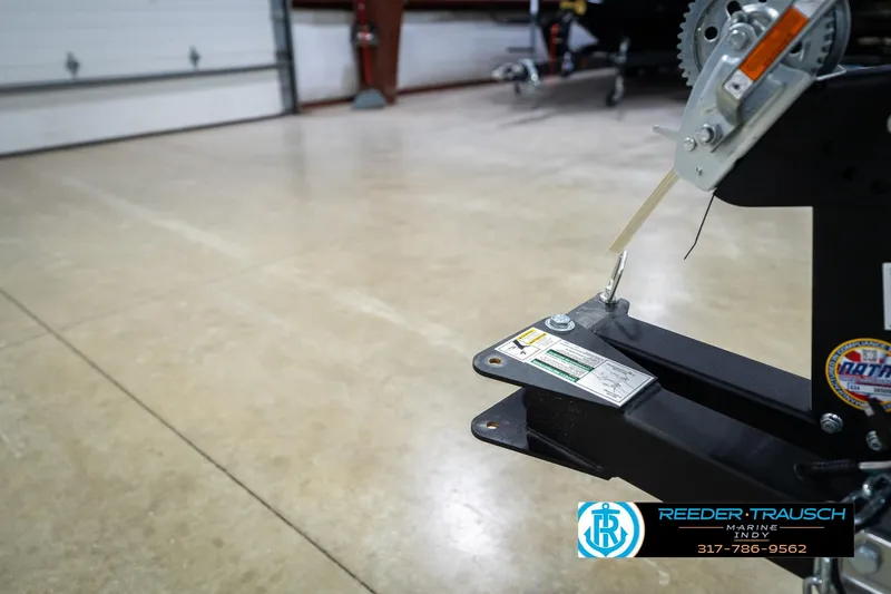 Slide: The Image of Winch detail of 2026 Lund 1675 Adventure SS boat trailer in a showroom. - 48
