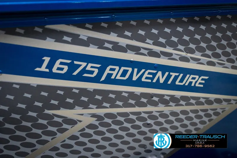 Slide: The Image of 2026 Lund 1675 Adventure SS boat graphic with Reeder-Trausch Marine logo. - 49