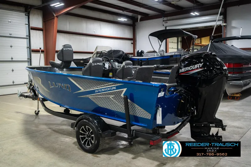 Slide: The Image of 2026 Lund 1675 Adventure SS boat with Mercury engine in showroom. - 8