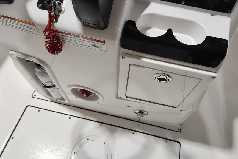 Slide: The Image of 2024 Edgewater 188CC boat console with safety features and storage compartments. - 10