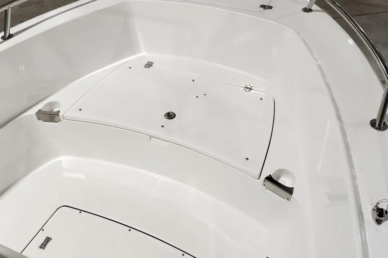 Slide: The Image of 2024 Edgewater 188CC boat interior with storage compartments and stainless steel fittings. - 11