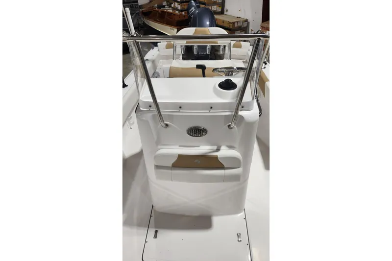 Slide: The Image of 2024 Edgewater 188CC boat interior with steering console and seating. - 12