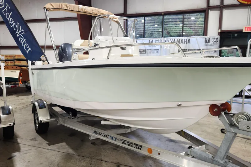 Slide: The Image of 2024 Edgewater 188CC boat on trailer in indoor showroom. - 2