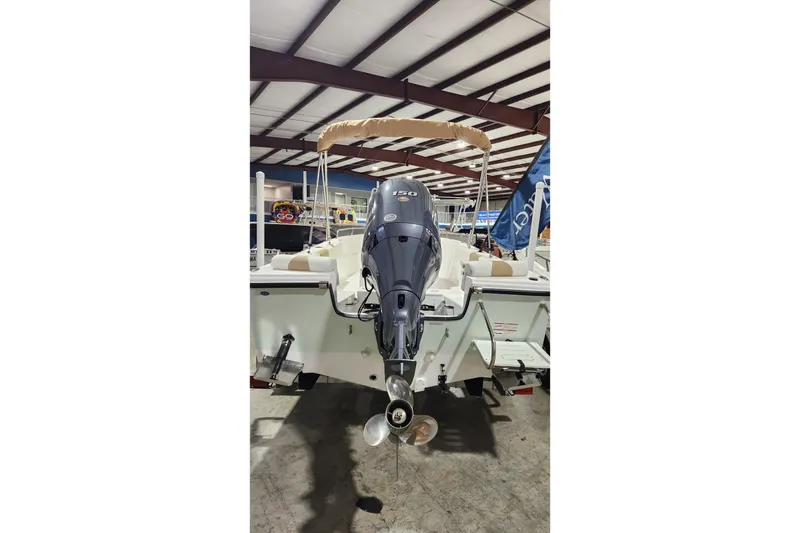 Slide: The Image of 2024 Edgewater 188CC boat with outboard motor in a showroom. - 3