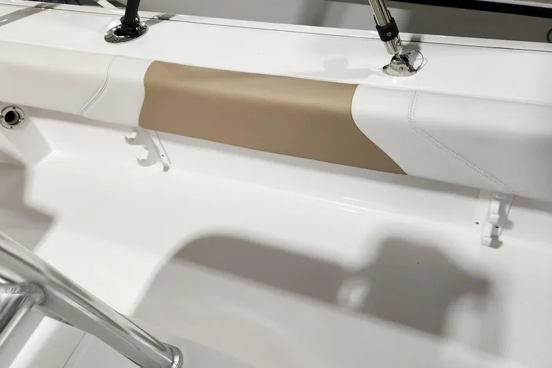 Slide: The Image of 2024 Edgewater 188CC boat interior with beige and white seating detail. - 5