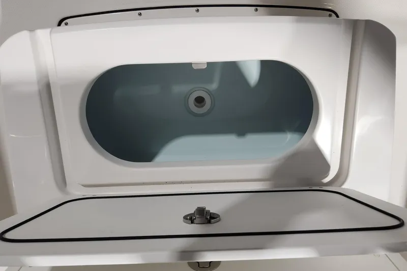 Slide: The Image of 2024 Edgewater 188CC boat compartment with open hatch, showcasing interior design. - 6