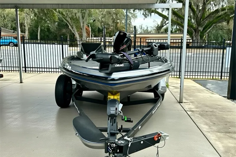 Slide: The Image of 2026 Ranger Z518 boat on trailer in covered parking area. - 12