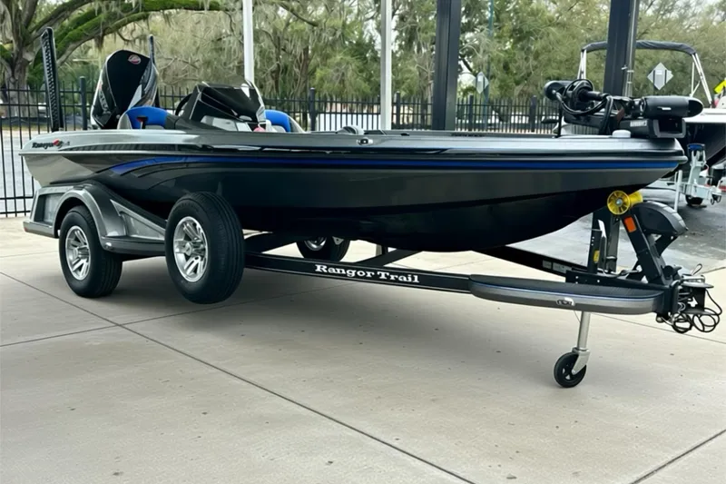 Slide: The Image of 2026 Ranger Z518 boat on trailer, sleek design, parked outdoors. - 13