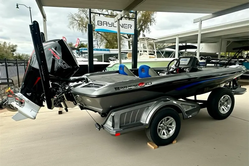 Slide: The Image of 2026 Ranger Z518 boat on trailer at dealership, featuring sleek design and powerful engine. - 14