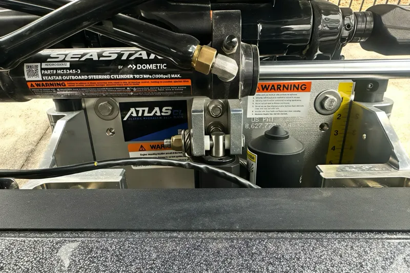 Slide: The Image of 2026 Ranger Z518 boat steering system with SeaStar hydraulic components and warning labels. - 15