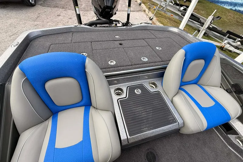 Slide: The Image of 2026 Ranger Z518 boat interior with blue and gray seats and storage compartments. - 3