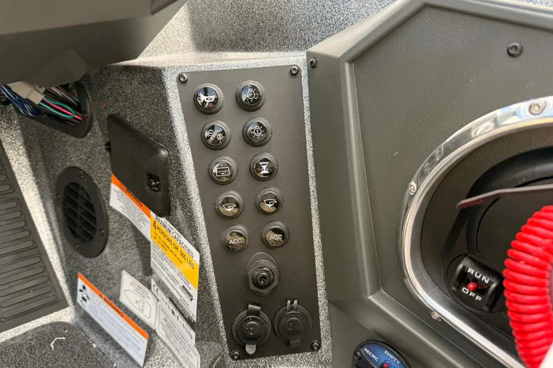 Slide: The Image of Control panel of 2026 Ranger Z518 boat with various switches and labels. - 6