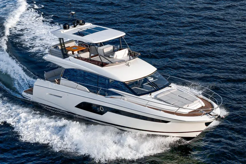 Slide: The Image of 2023 Prestige 520 yacht cruising on open water, showcasing sleek design and luxury features. - 17