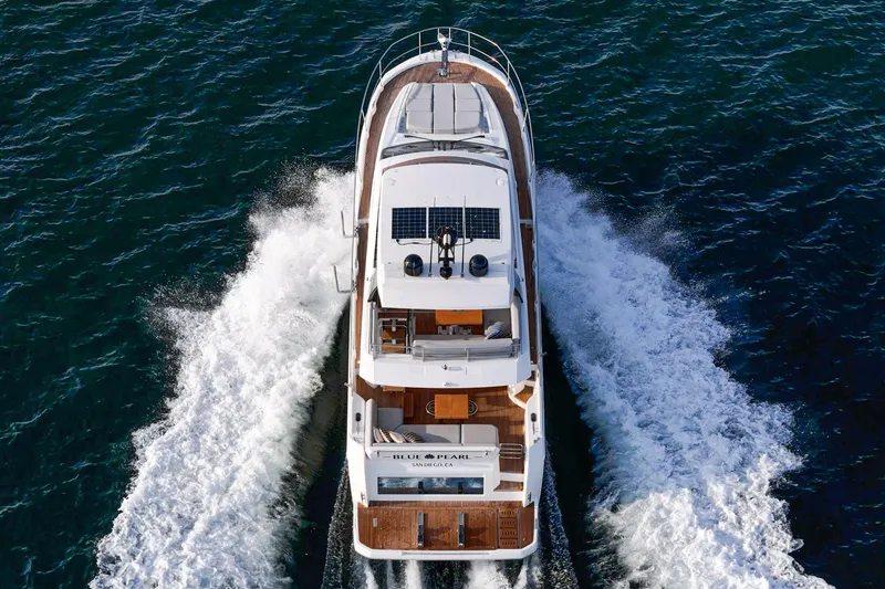 Slide: The Image of 2023 Prestige 520 yacht cruising on open water, aerial view. - 18
