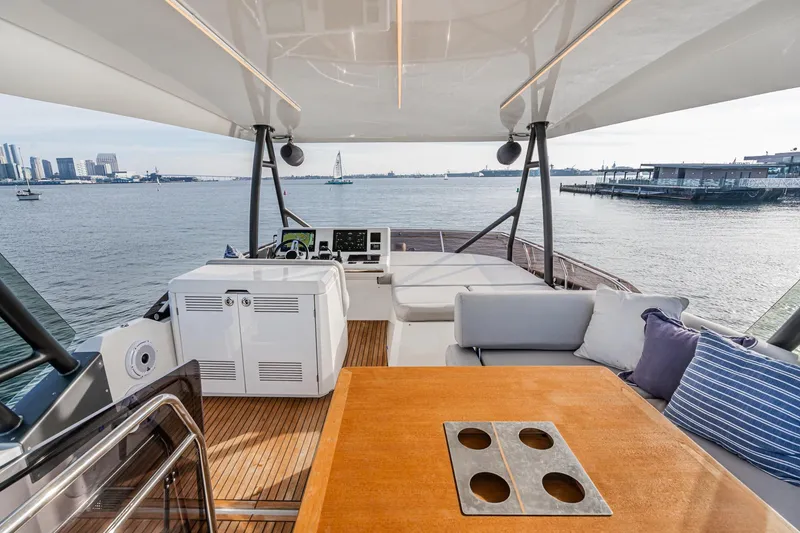 Slide: The Image of Luxurious 2023 Prestige 520 yacht interior with elegant seating and scenic waterfront view. - 28