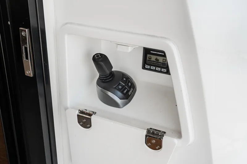 Slide: The Image of Control panel of 2023 Prestige 520 yacht with joystick and display. - 38