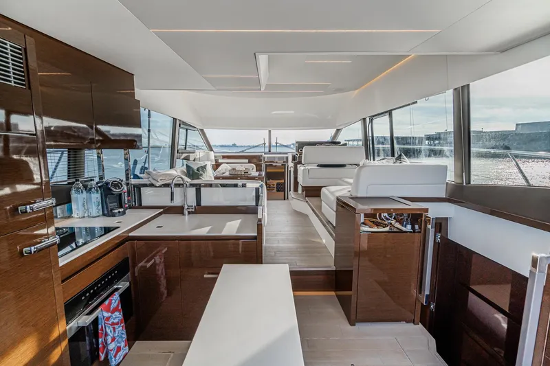 Slide: The Image of Luxurious interior of 2023 Prestige 520 yacht with modern kitchen and seating area. - 39